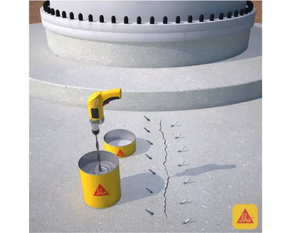 Perforaciones sobre losa de concreto con boquillas de inyección alineadas y mezcla de Sikadur 52 con taladro antes de aplicar